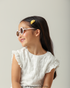 Criança com Óculos de Sol Infantil Hello Kitty Flower Bege Sanrio visão perfil 